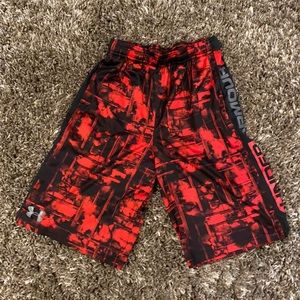 Black and red Under Armour shorts.